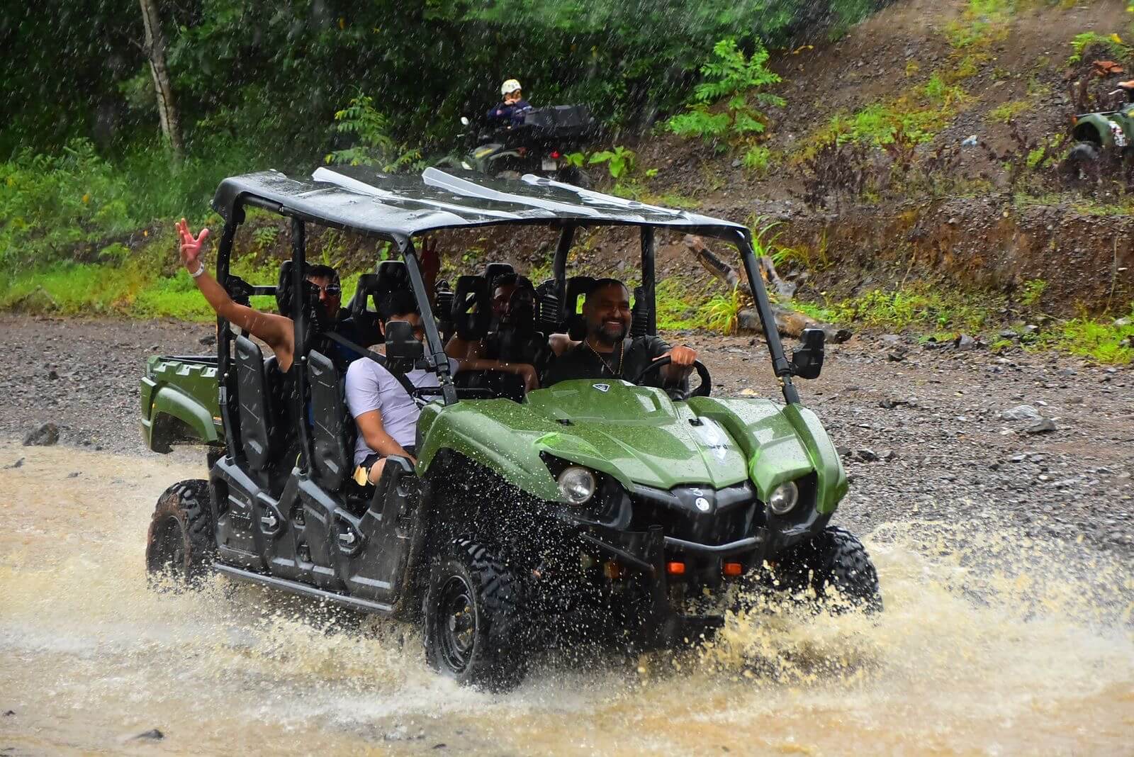 Guests enjoying a thrilling UTV ride through jungle trails in Jaco. Guests enjoying a thrilling UTV ride through jungle trails in Jaco.