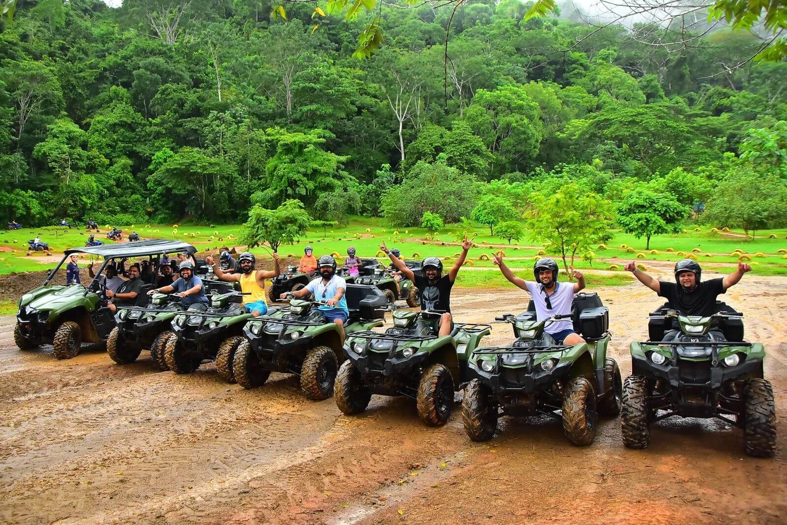 Friends ready to explore the jungle on their ATV adventure.