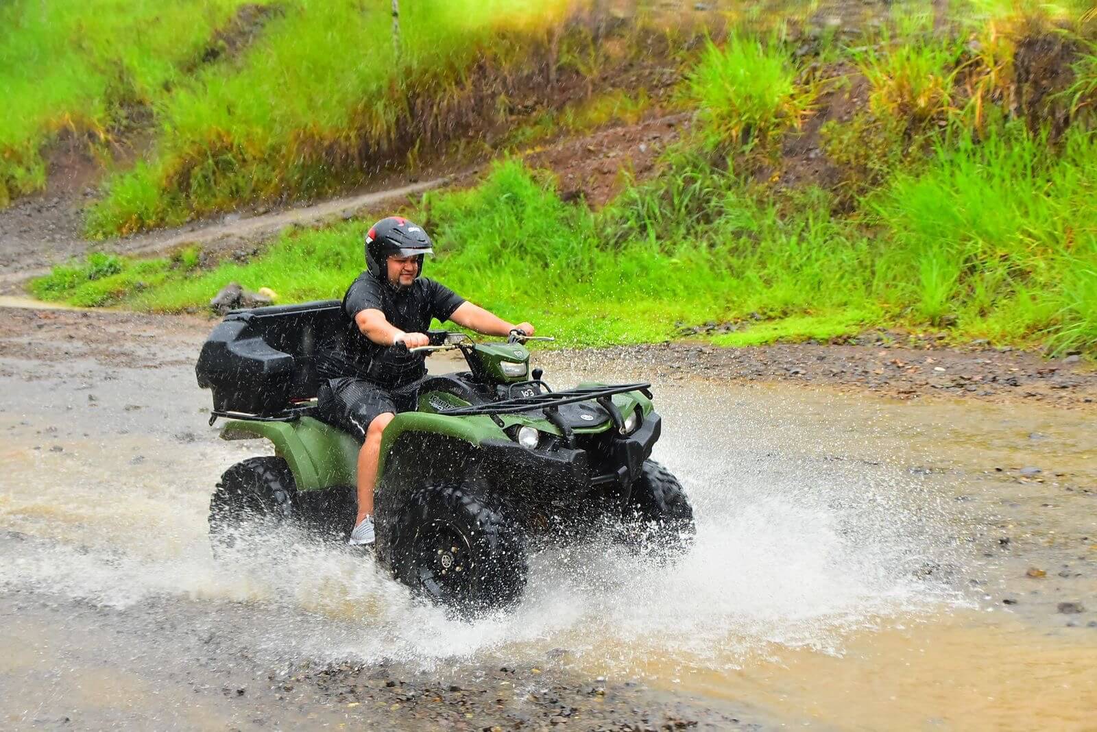 Conquering muddy trails on an ATV jungle adventure. Conquering muddy trails on an ATV jungle adventure.