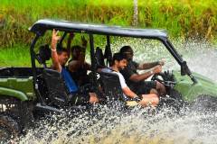 Splashing through rivers on a jungle ATV adventure.