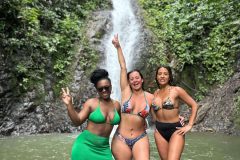 Guests enjoying the refreshing waterfall in Jaco.